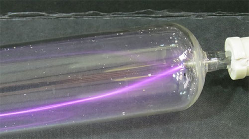 Purple arc discharge indicating an air leak in the seal.